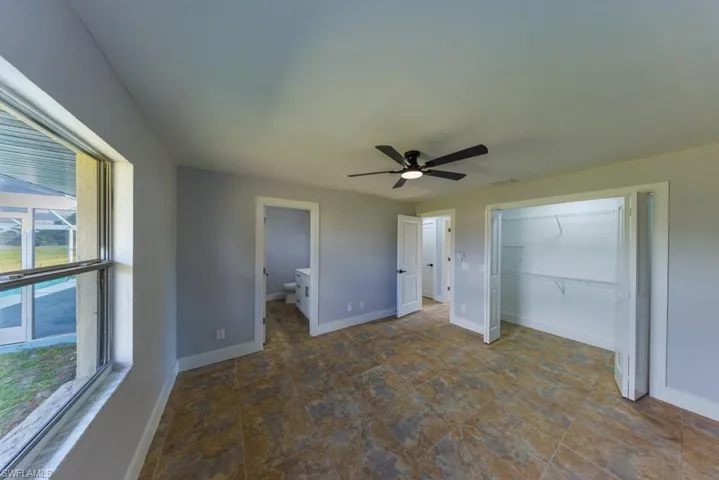 Private second master suite with ensuite bath and abundant natural light, ideal for guests, extended family, or dual primary living