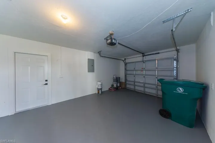 Spacious one-car garage with freshly painted floors — ideal for parking, storage, or a tidy workspace.