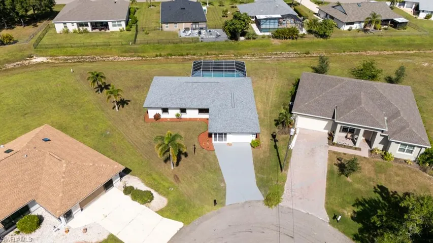 Aerial view of the property and surrounding neighborhood.