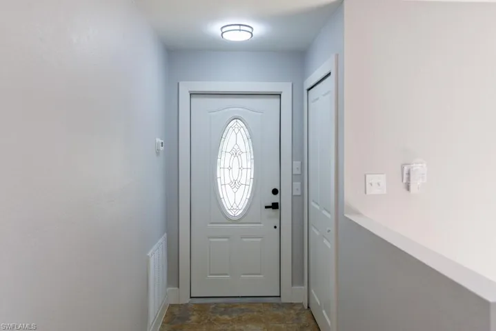 Bright and inviting foyer sets the tone for the home.