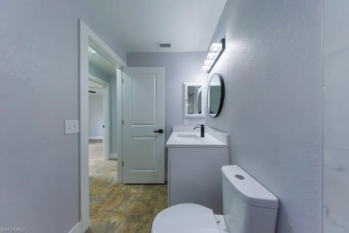 Modern guest bathroom featuring a stylish vanity, updated fixtures, and clean, neutral finishes, designed for both comfort and ease.