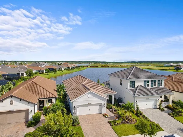 Aerial perspective of suburban area with a large body of water