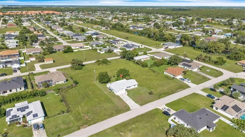 View of property location with nearby suburban area