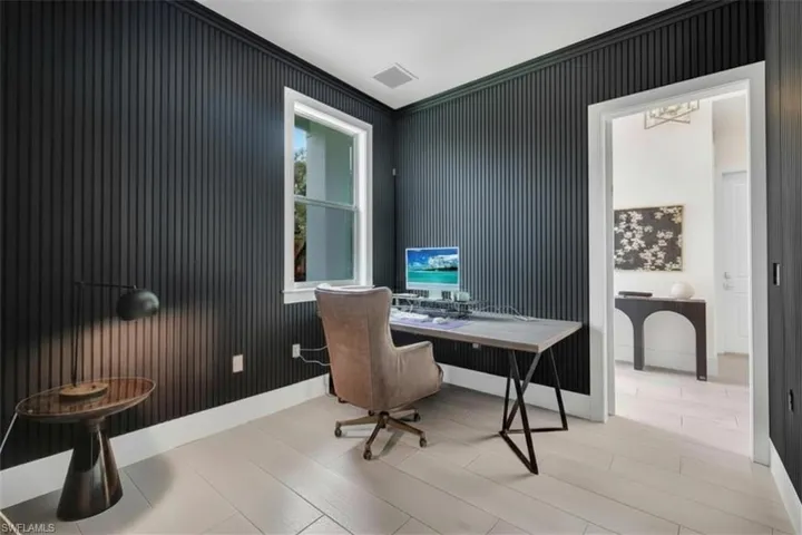 This room can be utilized as an office/den or as a fourth bedroom.