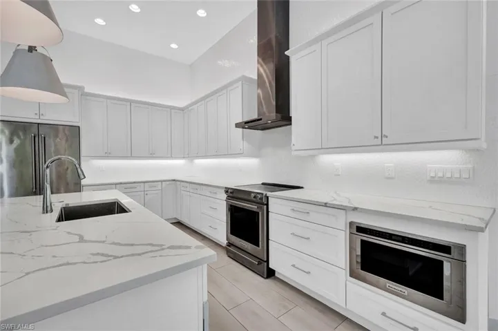 Kitchen offers custom cabinetry featuring soft-close drawers, sleek hardware, and plenty of storage for both style and function.