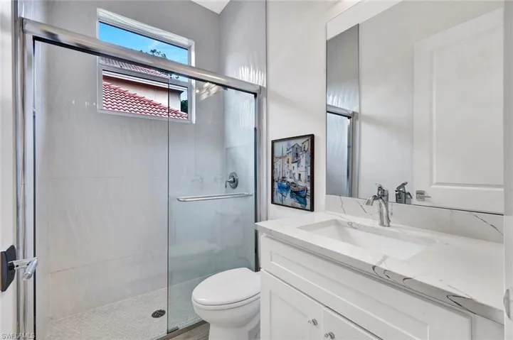 Third bathroom features a walk-in shower.
