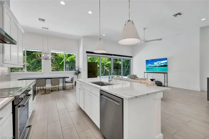 Living room, kitchen and dining room are open to one another.