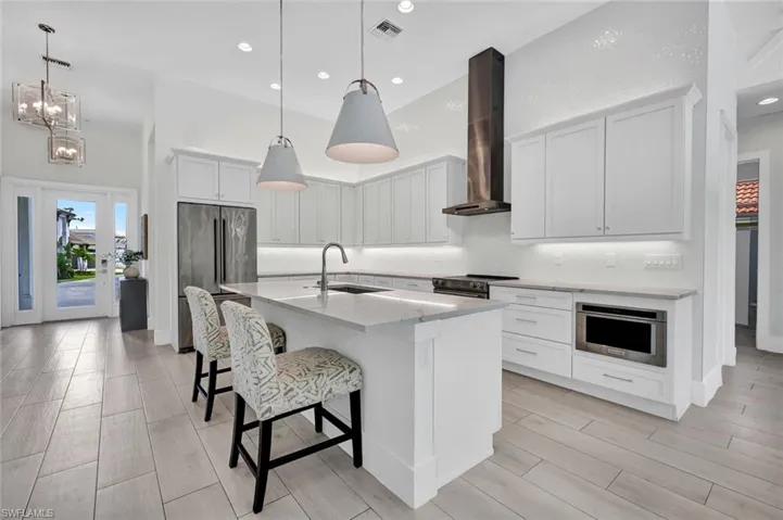 Spacious island, premium finishes, and beautiful lighting...this kitchen is ready for you to cook, entertain, and enjoy.