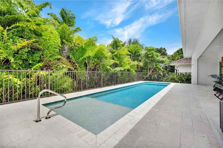 Pool features a large sun shelf.