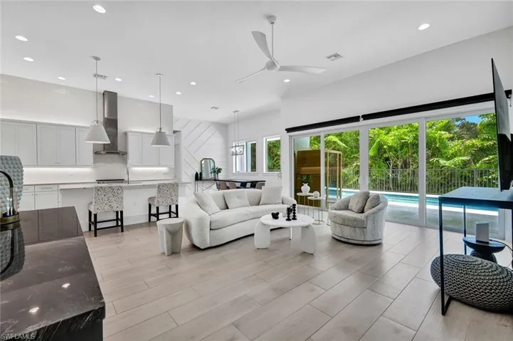 Gorgeous open floor plan, custom kitchen, beautiful flooring and thoughtful finishes.
