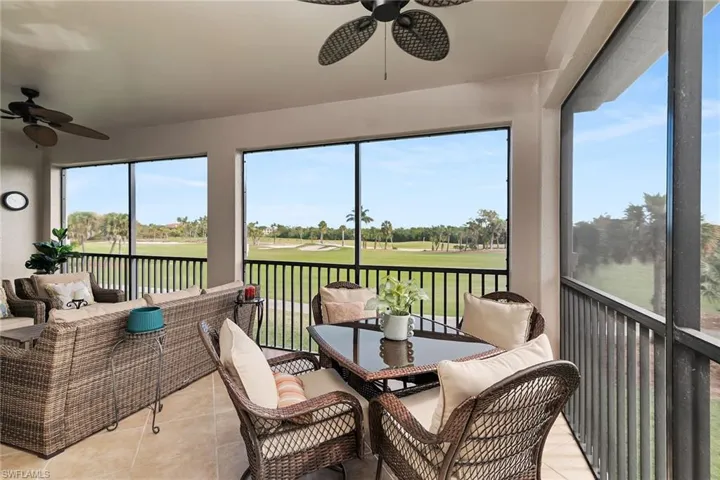 Screened lanai offering golf course views and ample space for outdoor seating.