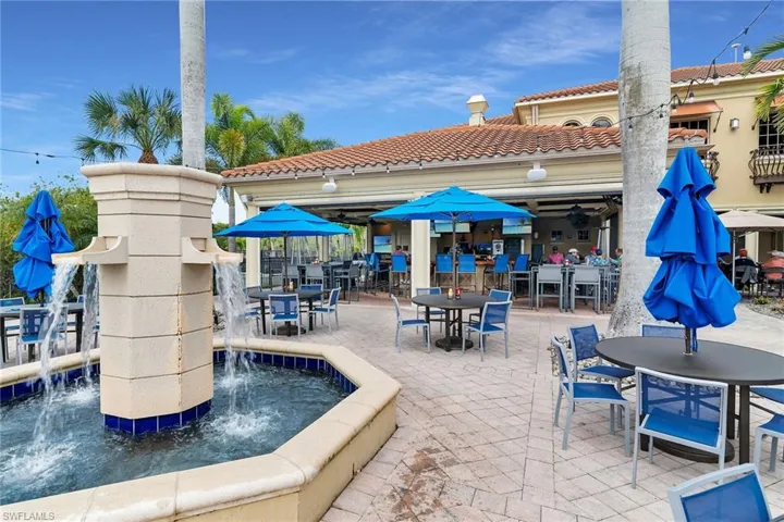 Poolside amenity area featuring a full-service bar and restaurant with covered seating, outdoor dining, and resort-style atmosphere for casual dining and social gatherings.