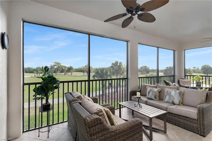 Screened lanai offering golf course views and ample space for outdoor seating.