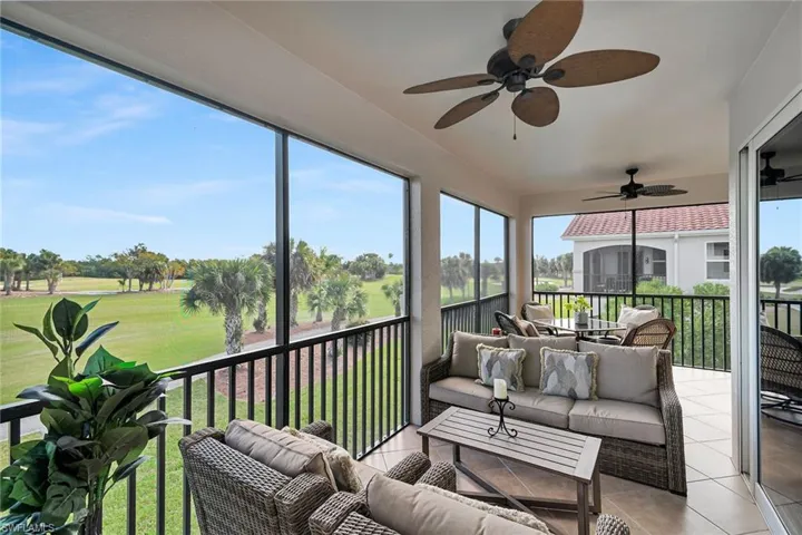 Screened lanai offering golf course views and ample space for outdoor seating.