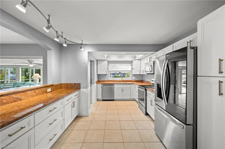 New White Cabinets with Gold Pulls