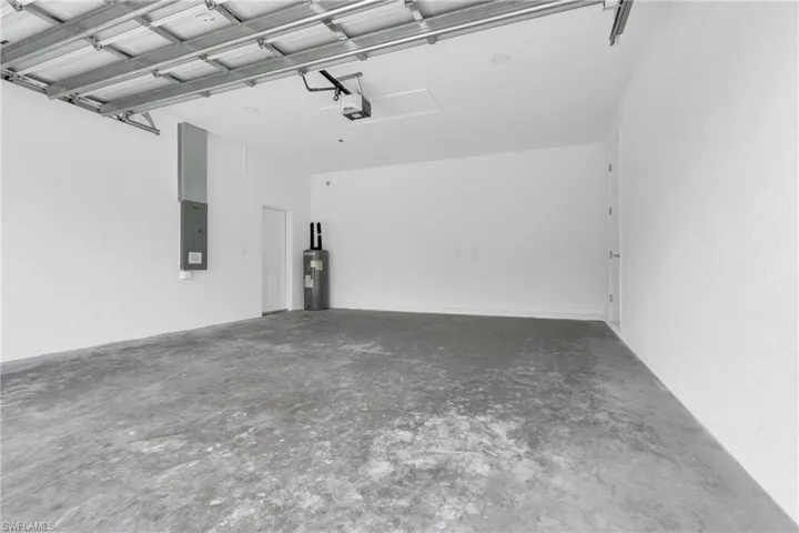 Garage with electric panel and electric water heater