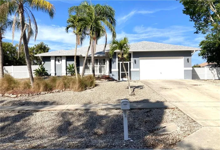 Single story home featuring a garage
