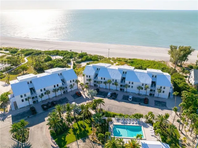 Aerial view of a pool and unending shoreline