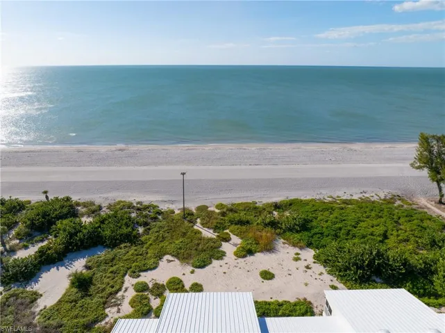 Aerial view of waterfront with a beach
