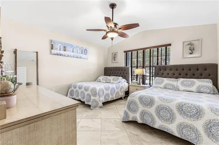 Guest bedroom looks out to the front of the property.