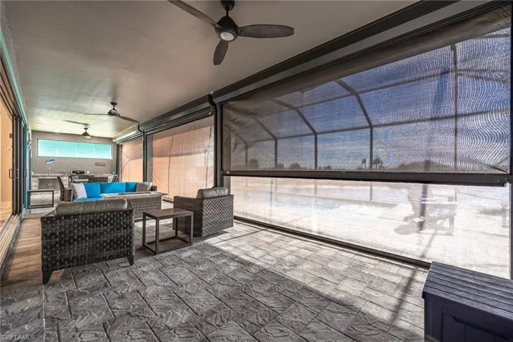 Screened lanai offers both electric sun screens and hurricane screens.