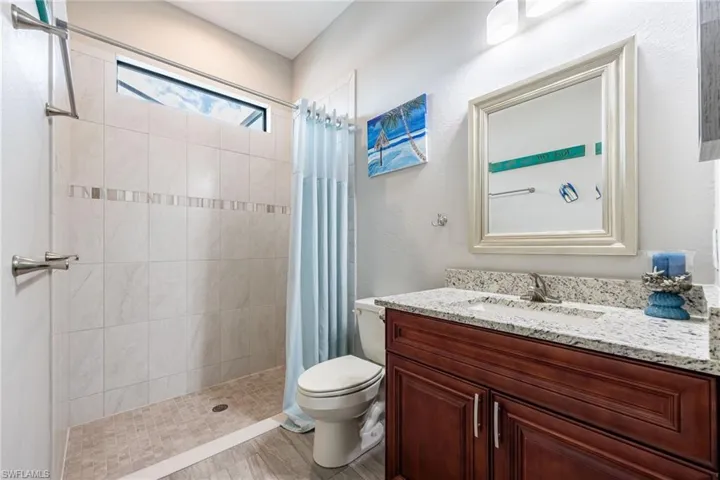 En suite bath has outside access to lanai