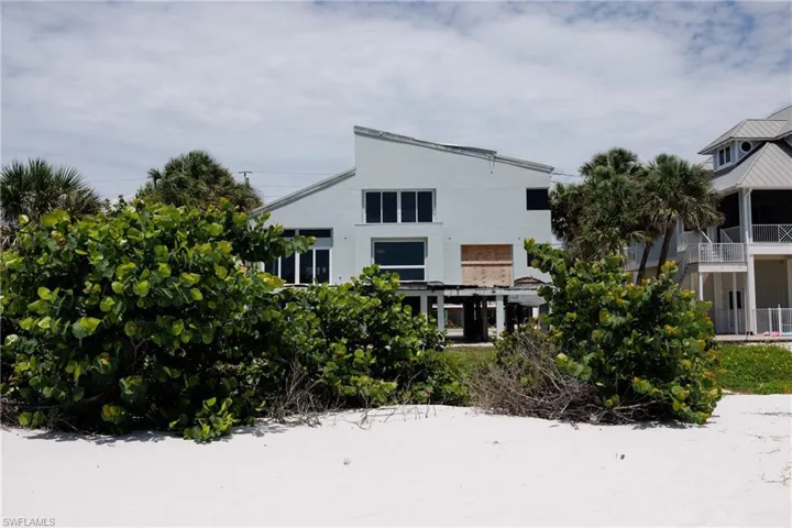 Rear view of house with stucco siding