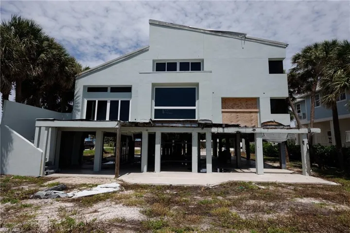 Rear view of house featuring a patio and stucco siding