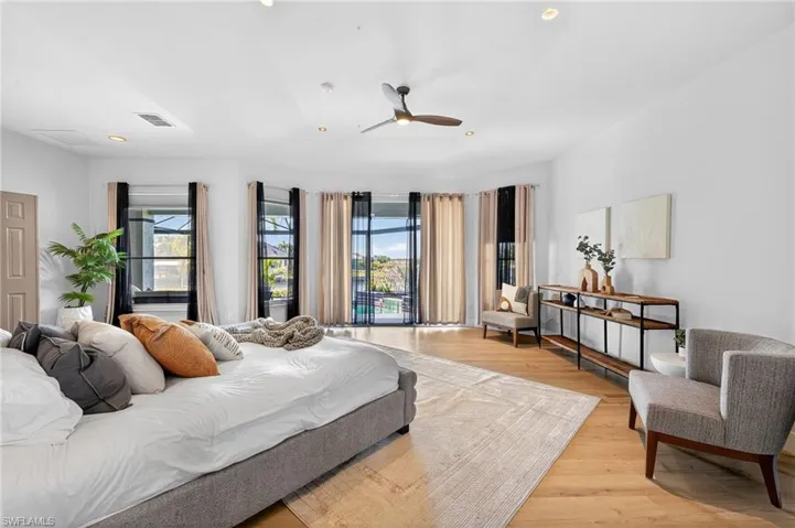 Bedroom featuring wood finished floors, ceiling fan, and recessed lighting