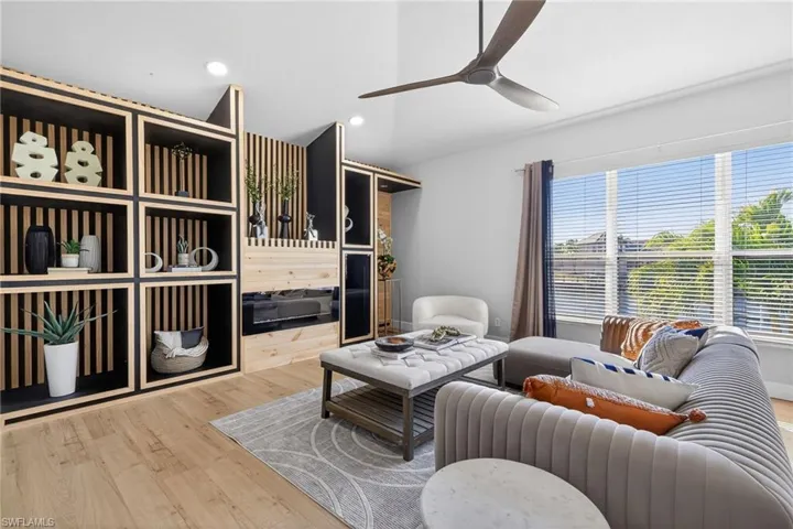 Living room featuring ceiling fan, wood finished floors, and recessed lighting