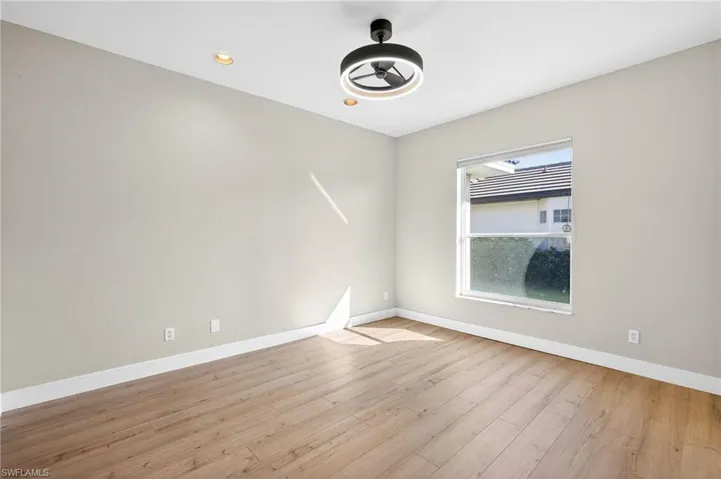 Unfurnished room with light wood-style floors, recessed lighting, and a ceiling fan