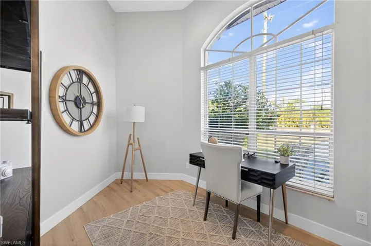 Office featuring light wood-style floors and baseboards