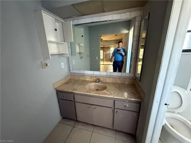 Bathroom featuring vanity and light tile patterned floors