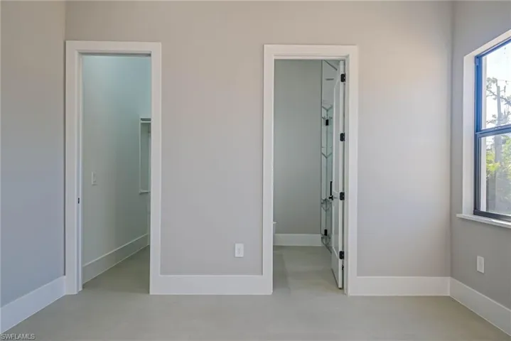 Unfurnished bedroom featuring a spacious closet