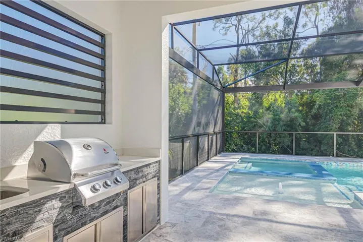View of patio / terrace featuring area for grilling and exterior kitchen
