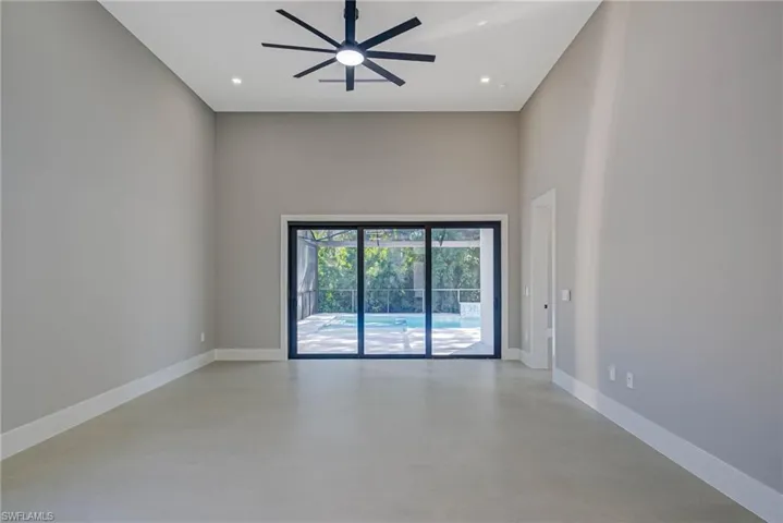 Spare room with ceiling fan
