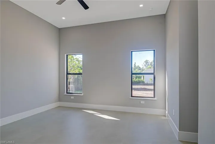 Empty room featuring ceiling fan