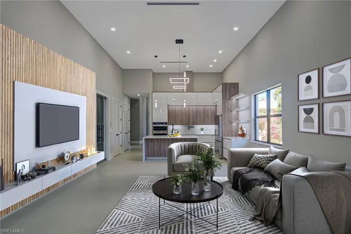 Living room featuring a towering ceiling