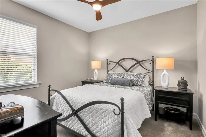 Bedroom with carpet floors and a ceiling fan