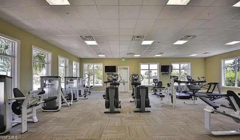 Gym with a paneled ceiling