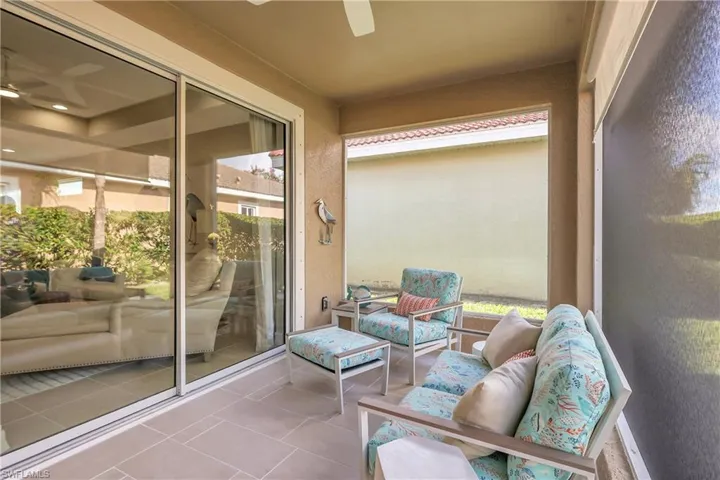 Balcony with ceiling fan and an outdoor hangout area