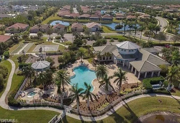 Aerial overview of property's location with a nearby body of water and nearby suburban area