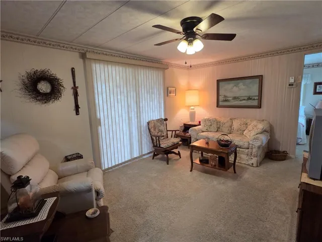 Living room with view to the Florida room and Bedroom.