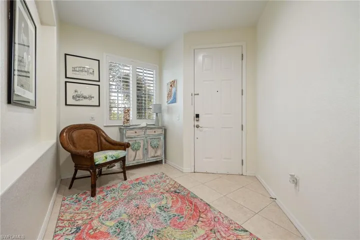 Entrance foyer with light tile
