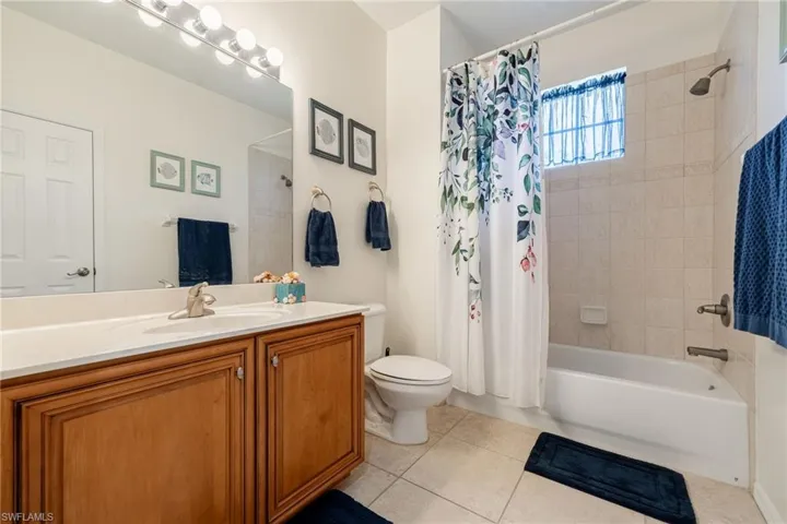 Bathroom featuring vanity, shower / bathtub combination