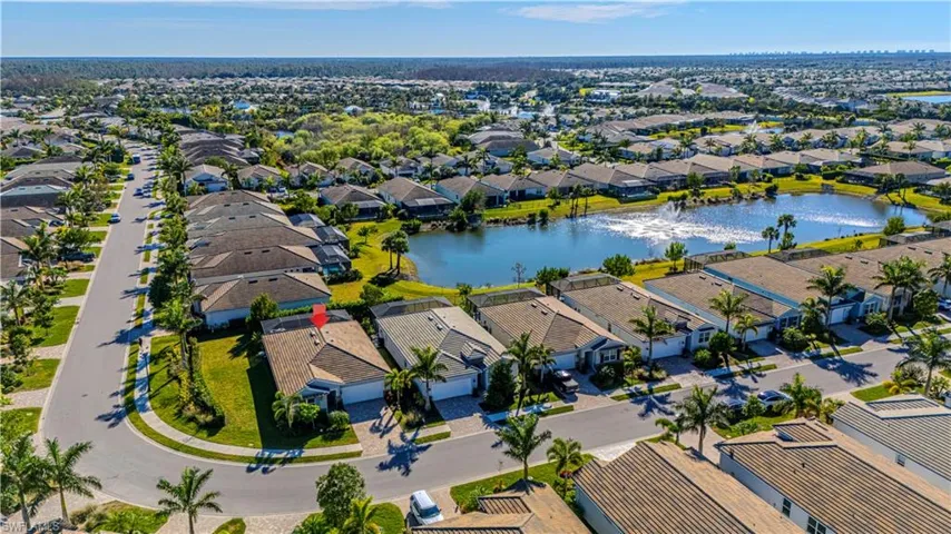 Birds eye view of property featuring a water view & large corner lot