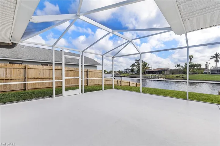 Additional screened patio space and fenced backyard.