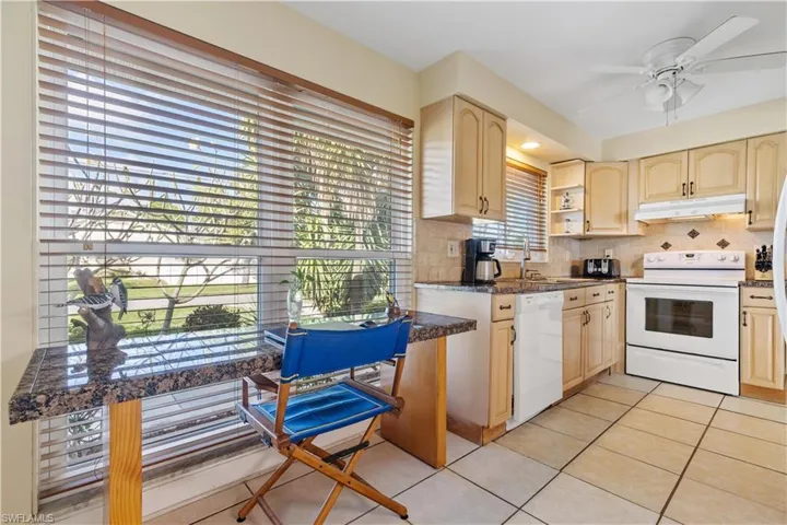 Kitchen with extra work space/desk.