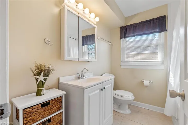 Guest Bathroom with tub/shower and Impact Window.
