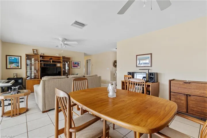 Dining-Living Area with hallway to bedrooms (center background).